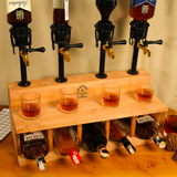 Wooden liquor dispenser set with four bottles and glasses on a wooden stand.