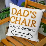 a pillow that says dad's chair on it