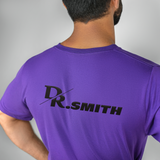 back view of a man wearing a purple doctor t-shirt