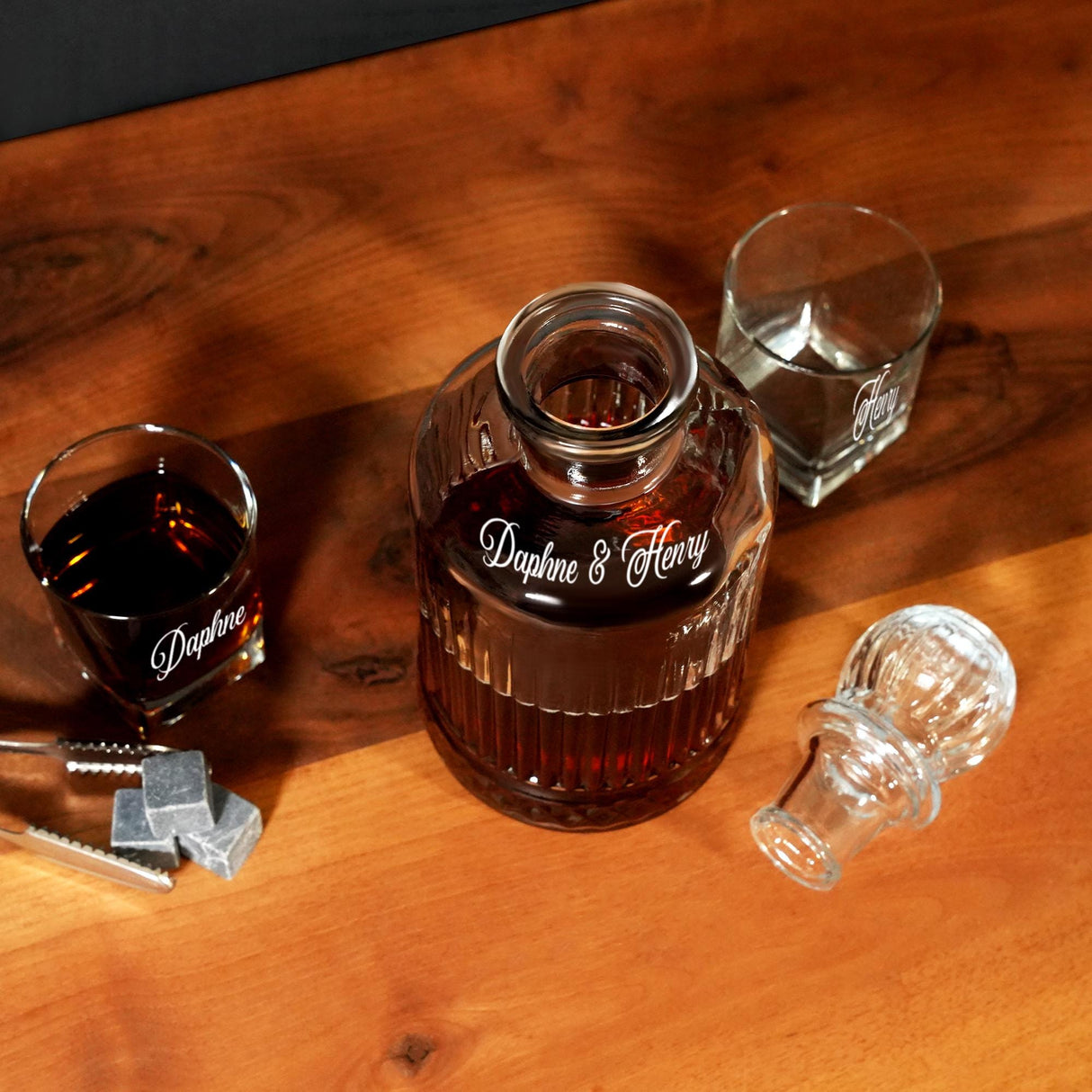 a bottle of liquor sitting on top of a wooden table
