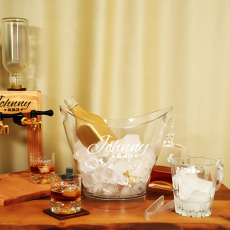 a wooden table topped with glasses and a bottle of wine