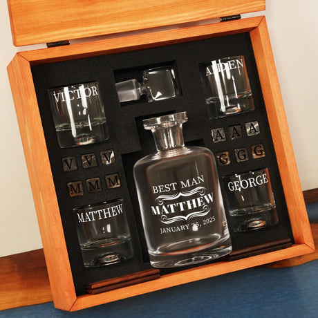 a set of personalized whiskey glasses in a wooden box