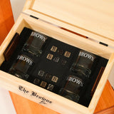 a wooden box with six shot glasses in it