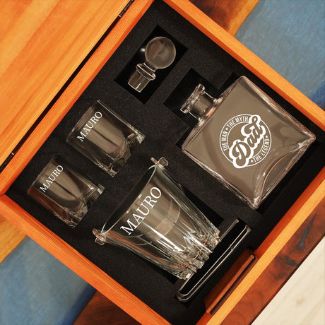 a set of three shot glasses in a wooden box