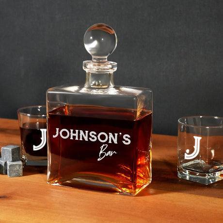 a bottle of liquor sitting on top of a wooden table