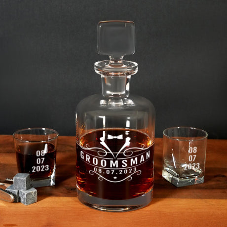 a bottle of groomsman whiskey next to two shot glasses