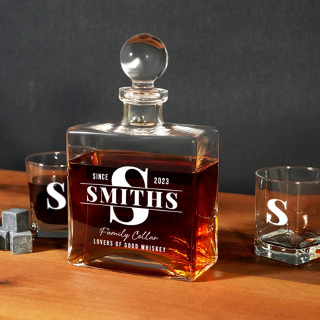 a bottle of smith&#39;s whiskey sitting on a table next to two shot glasses