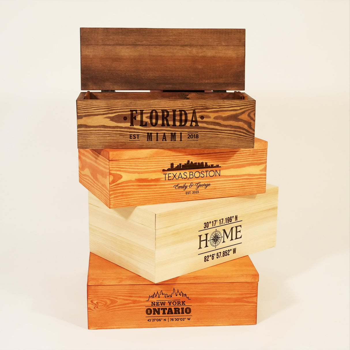 a stack of four wooden boxes sitting on top of each other
