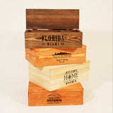 a stack of four wooden boxes sitting on top of each other