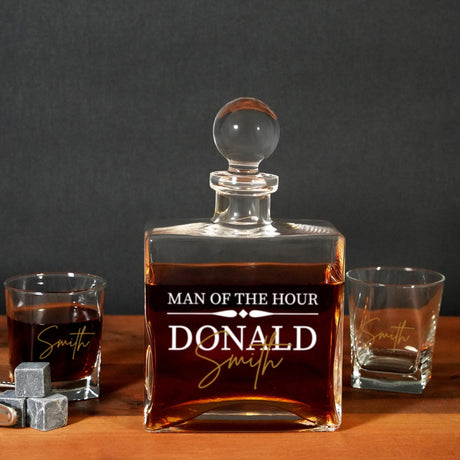 a bottle of whiskey sitting on top of a wooden table