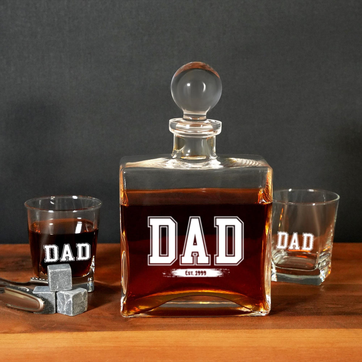 a bottle of whiskey sitting next to two shot glasses