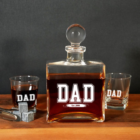 a bottle of whiskey sitting next to two shot glasses