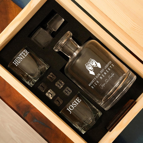 a wooden box with three glasses in it