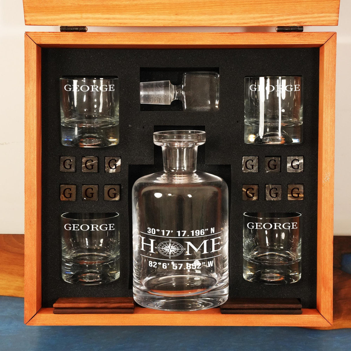 a set of glasses and a decanter in a wooden box