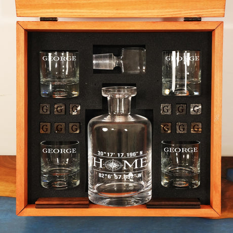 a set of glasses and a decanter in a wooden box