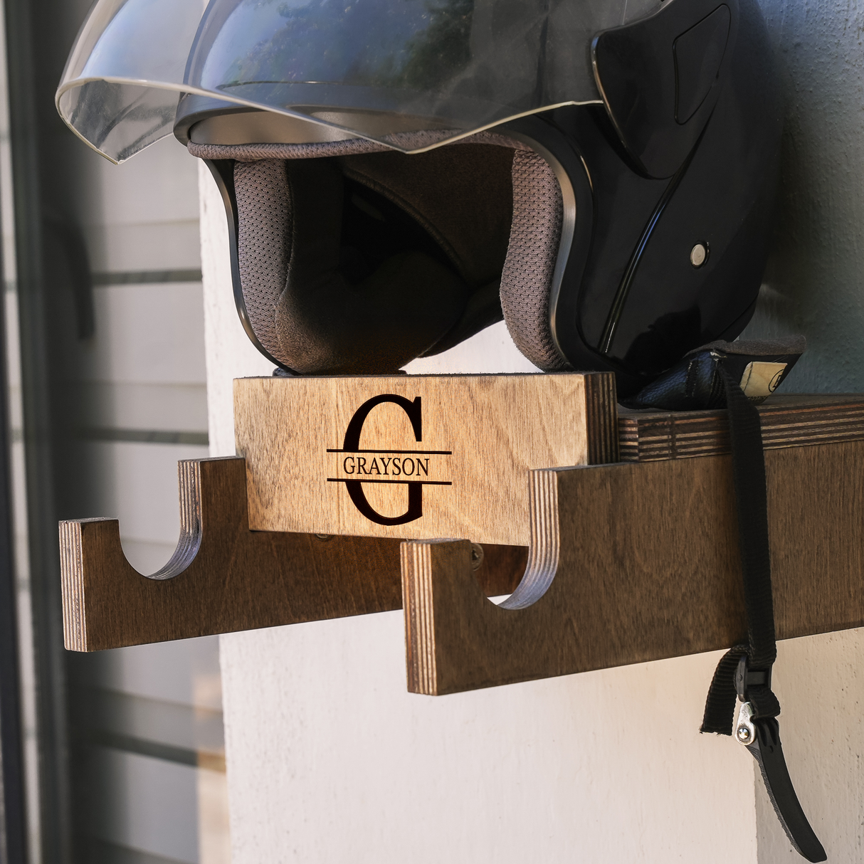 close-up of a wall-mounted bicycle holder with a helmet on it