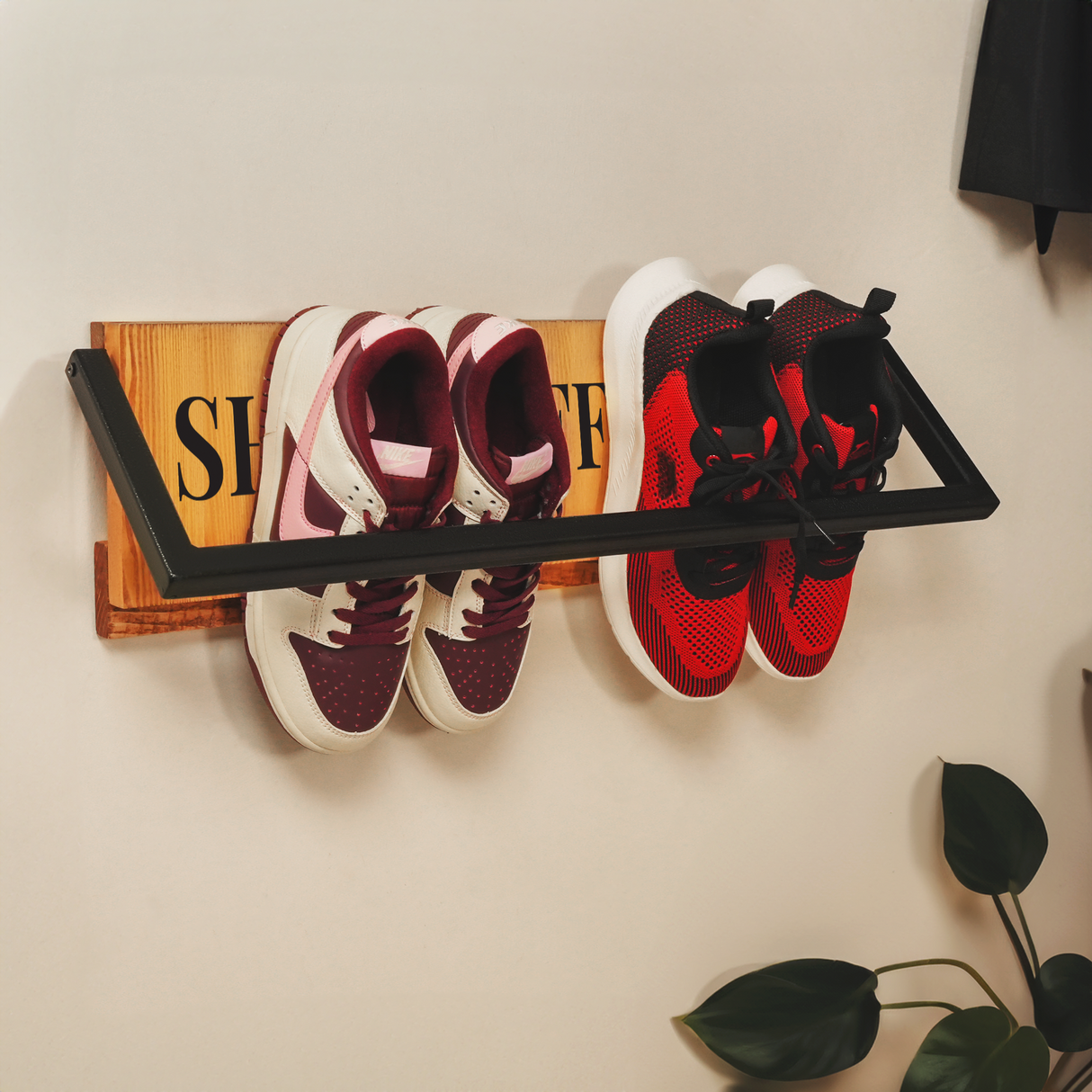 a wall-mounted shoe rack with two shoes on it