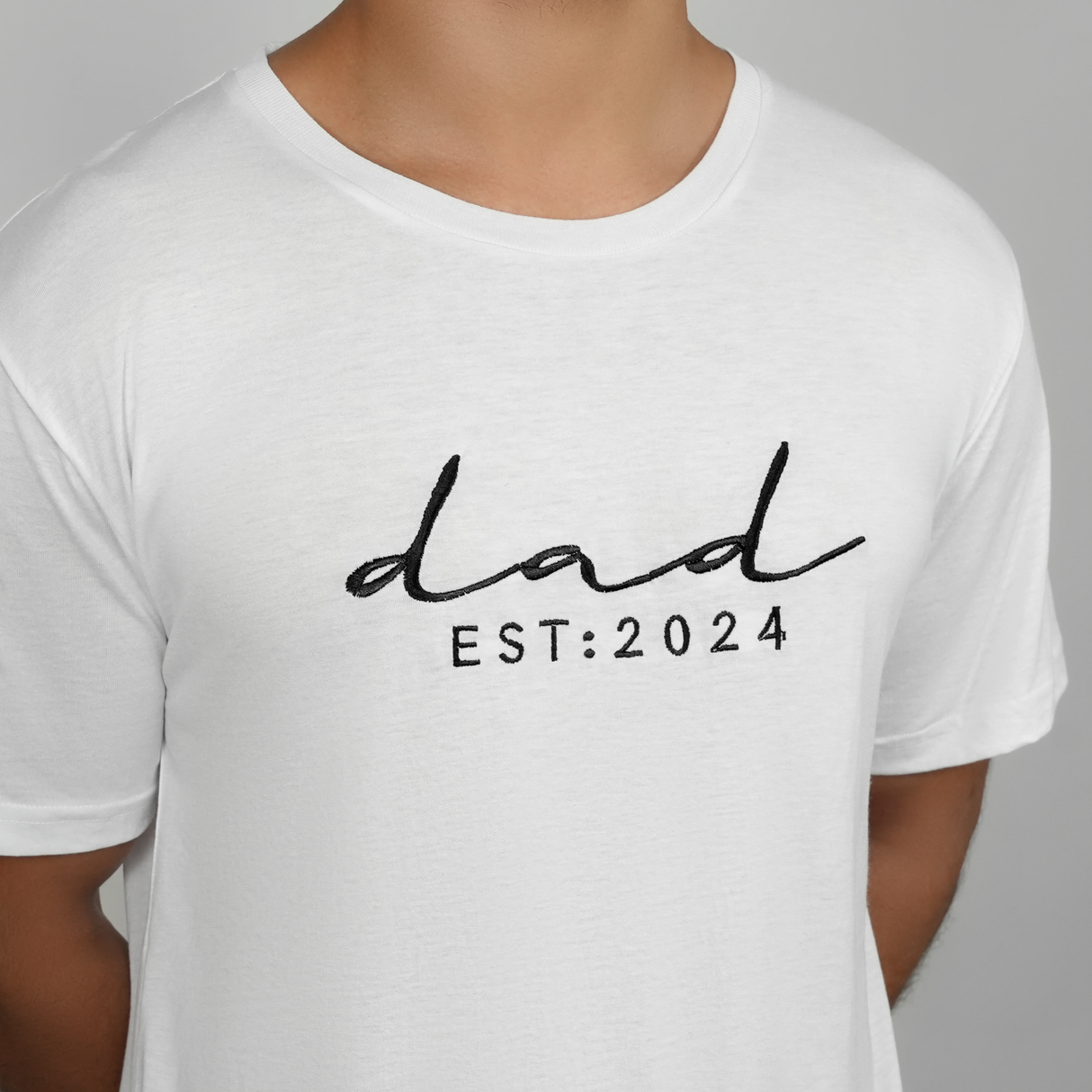 a man wearing a white dad T-shirt