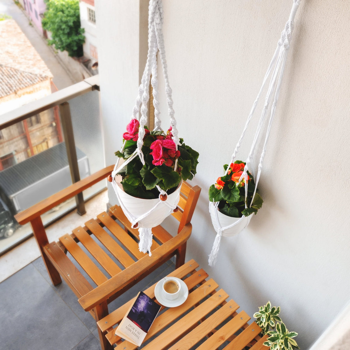 a couple of hanging planters filled with flowers