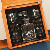 a wooden box with a bottle of liquor and shot glasses
