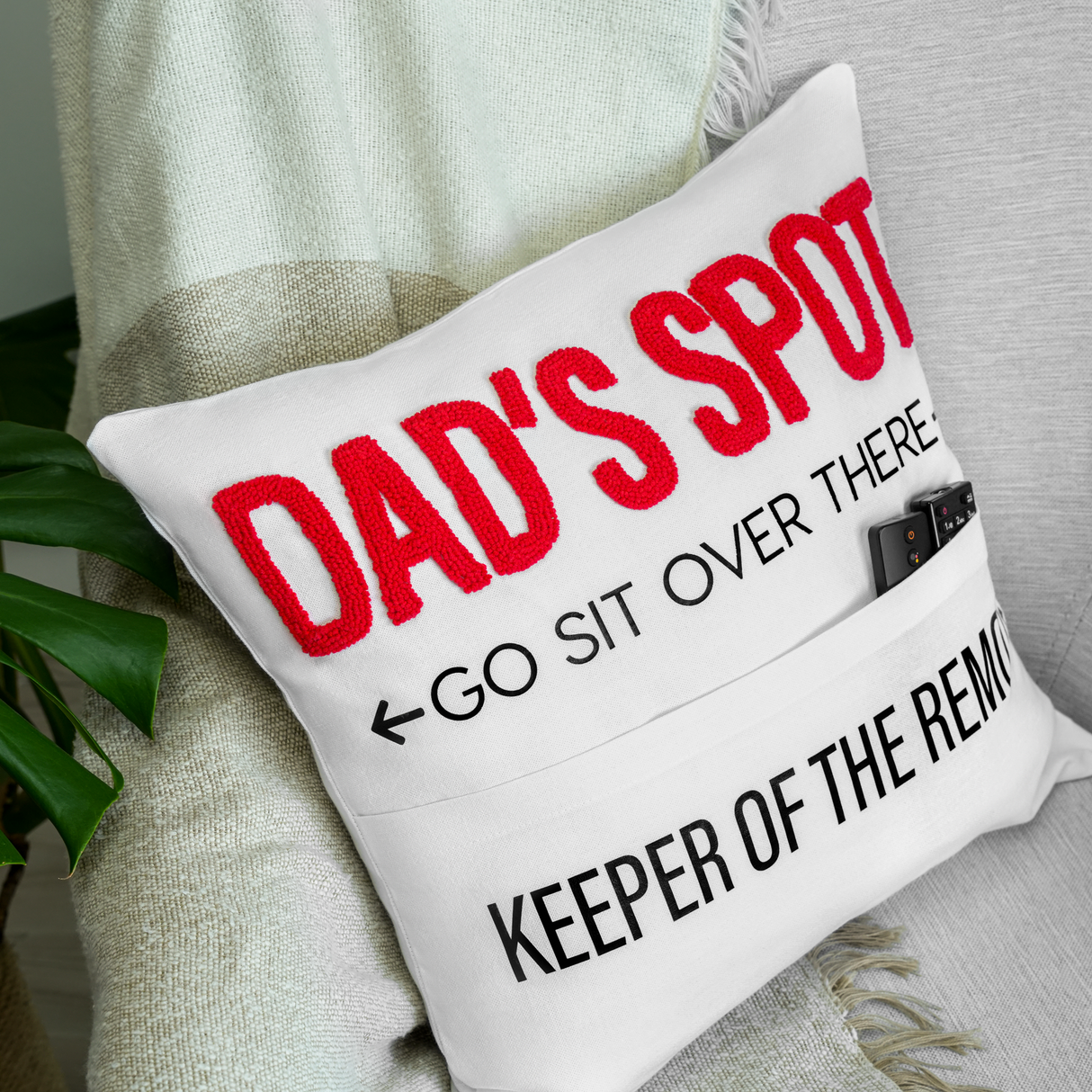 a pillow that says dad's spot, go sit over there keep off the