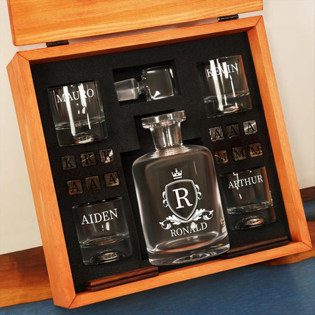 a bottle of alcohol and shot glasses in a wooden box