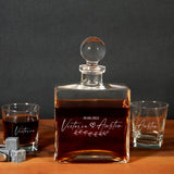 a bottle of whiskey sitting next to two shot glasses