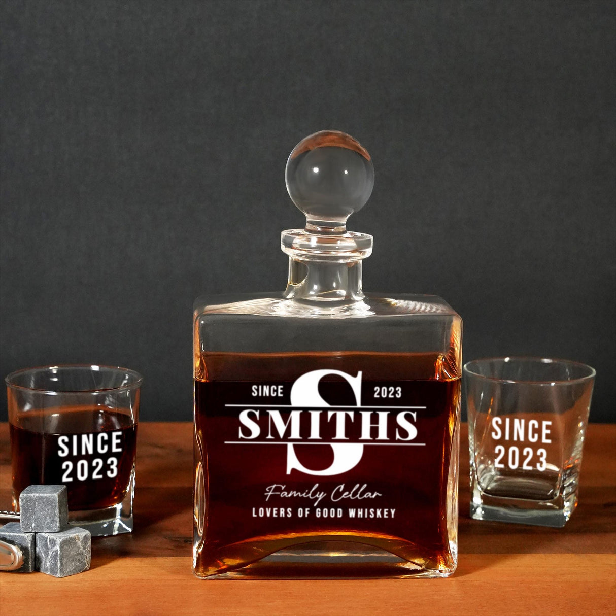 a bottle of smoth&#39;s whiskey next to two shot glasses