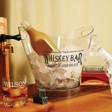 a bottle of whiskey sitting in a glass on a table
