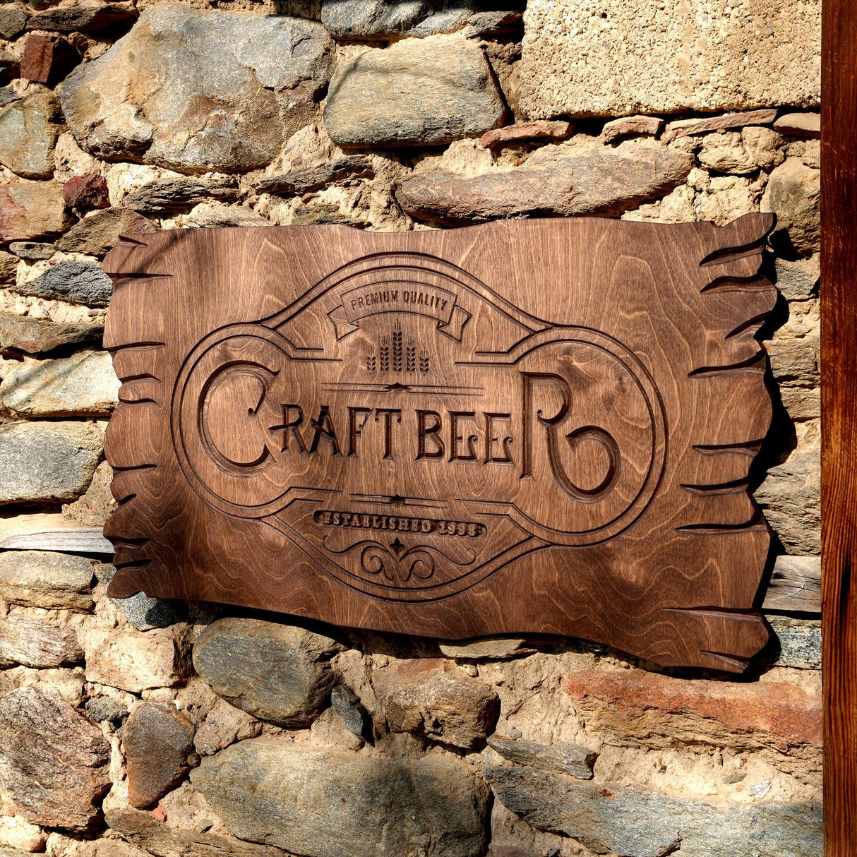 a wooden sign on a stone wall that says ratt beer