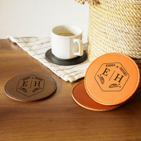 two coasters sitting on a table next to a cup of coffee