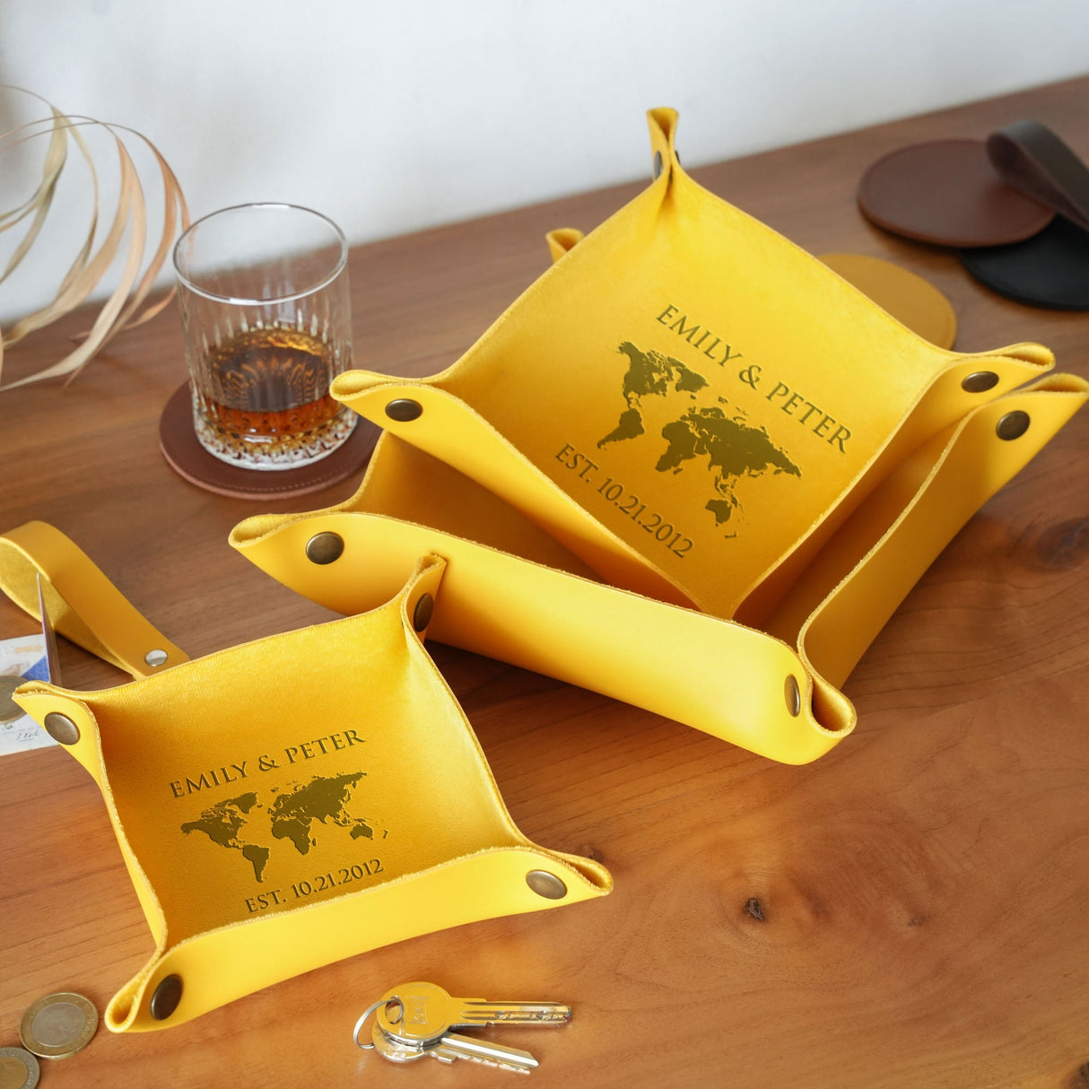 a wooden table topped with yellow serving dishes