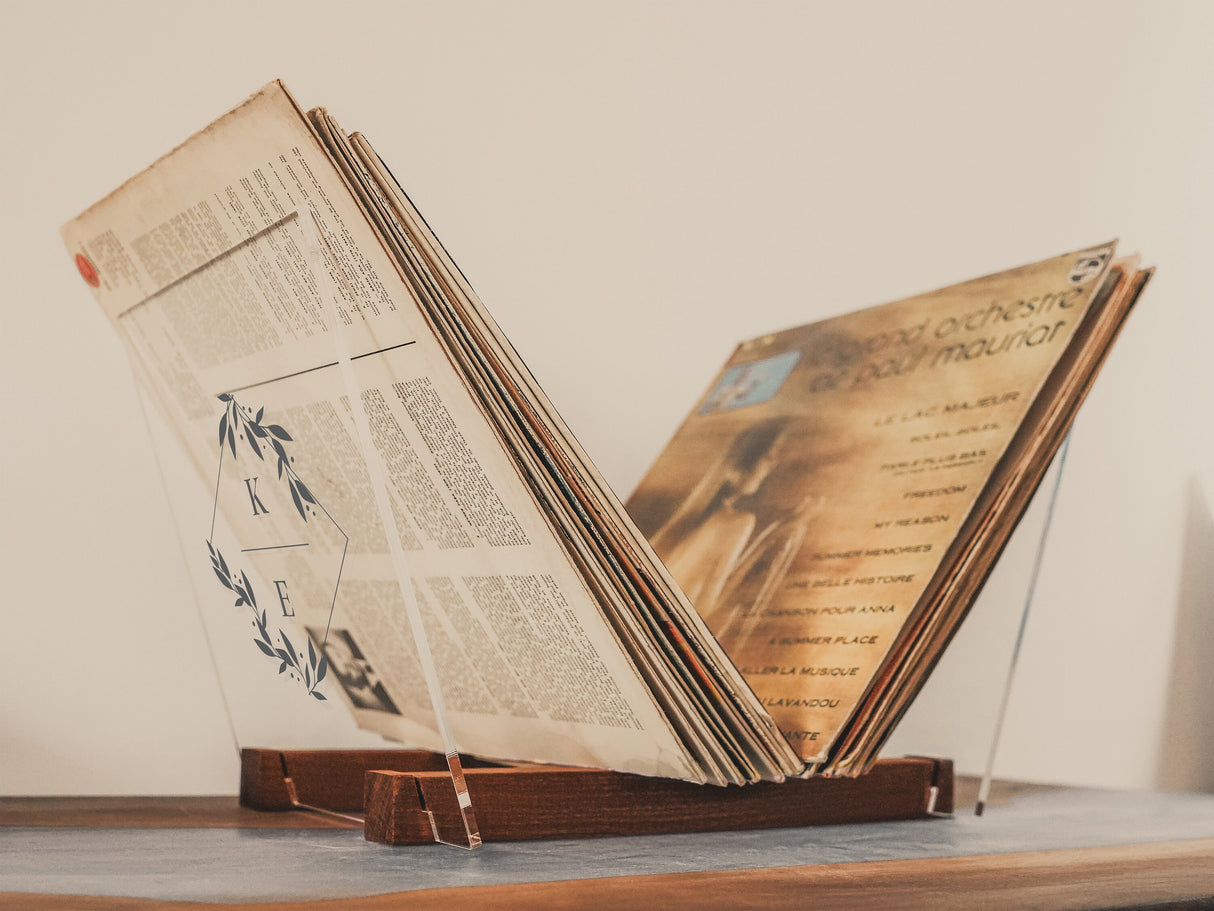 an open book sitting on top of a wooden table