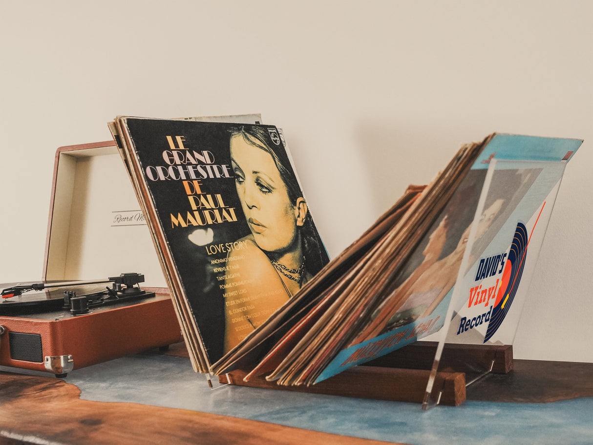 a record player sitting on top of a wooden table