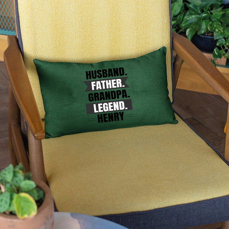 a green pillow sitting on top of a wooden chair