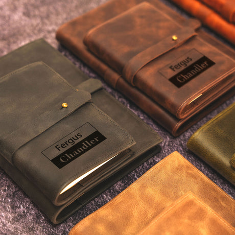 a group of leather folders sitting on top of a carpet