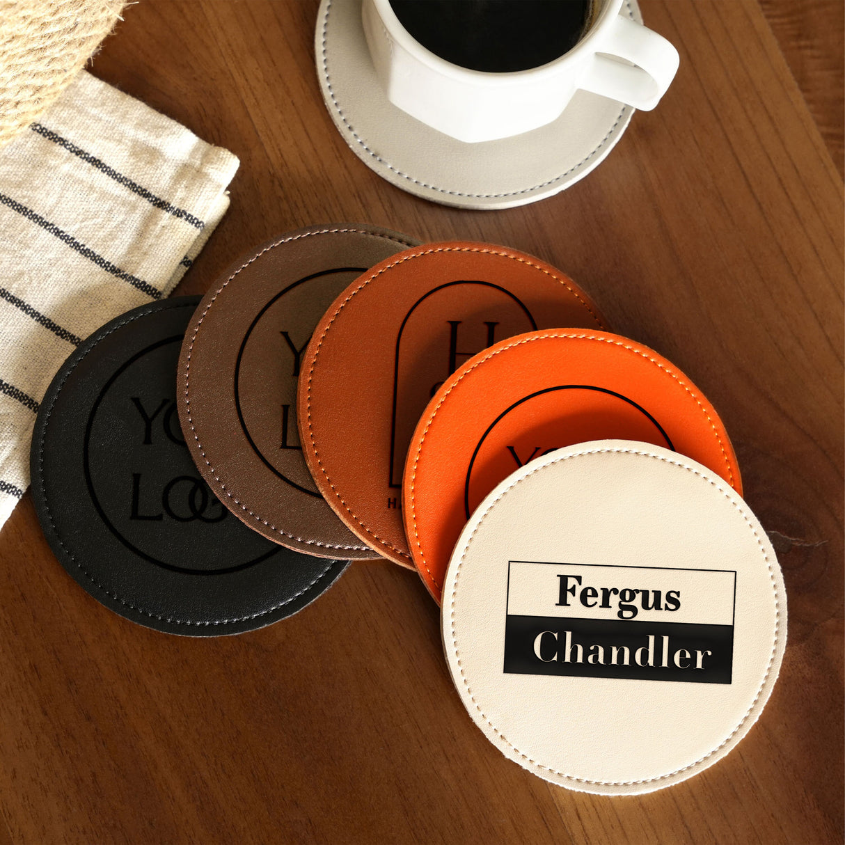 a table topped with coasters and a cup of coffee