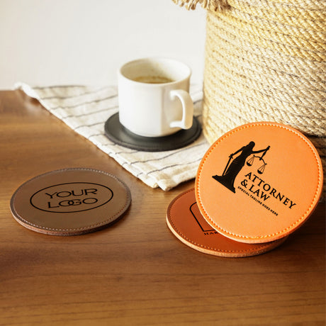 a couple of coasters sitting on top of a wooden table