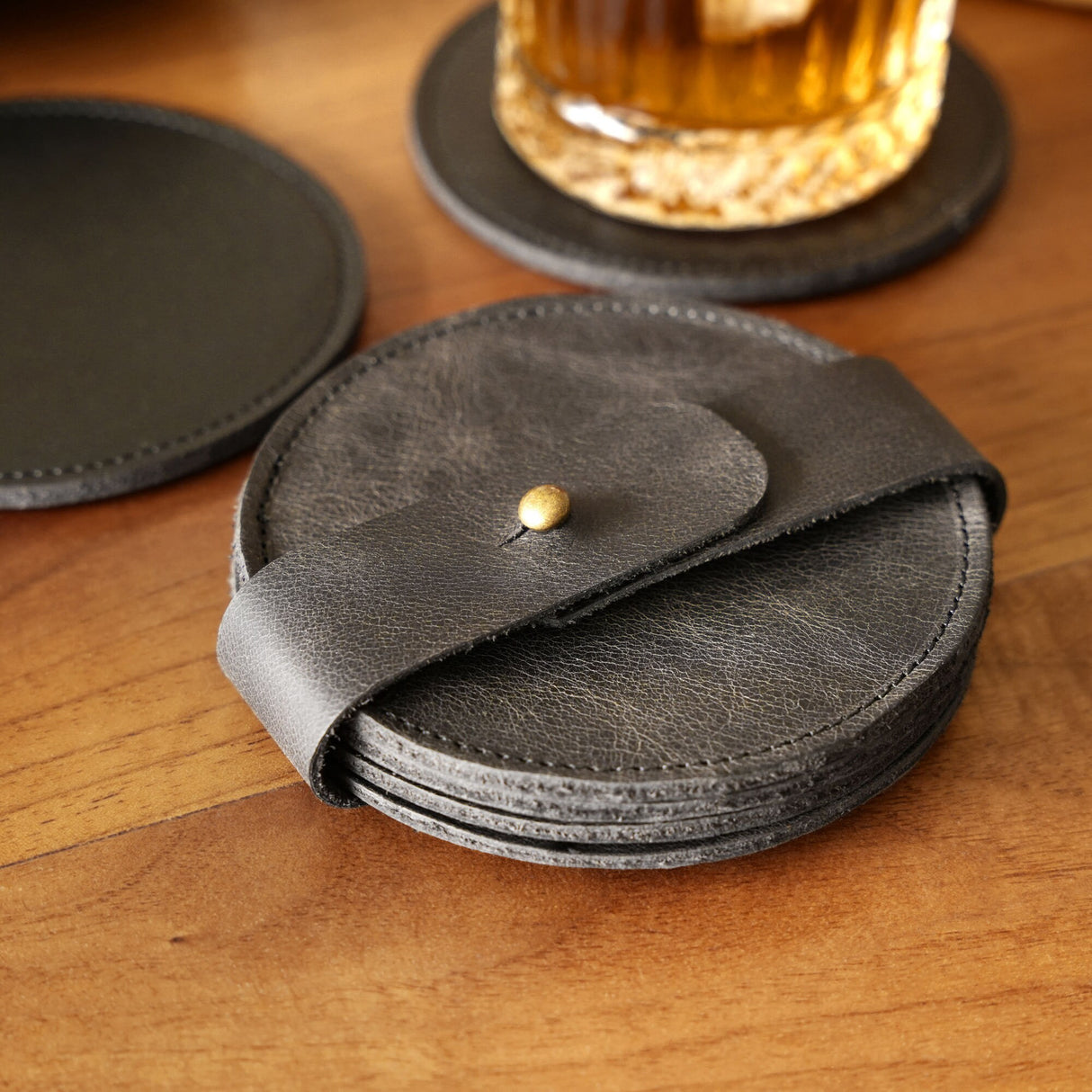 a leather wallet sitting on top of a wooden table