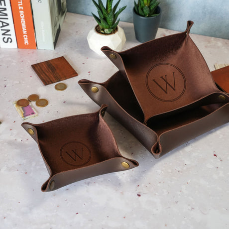 a couple of brown trays sitting on top of a table