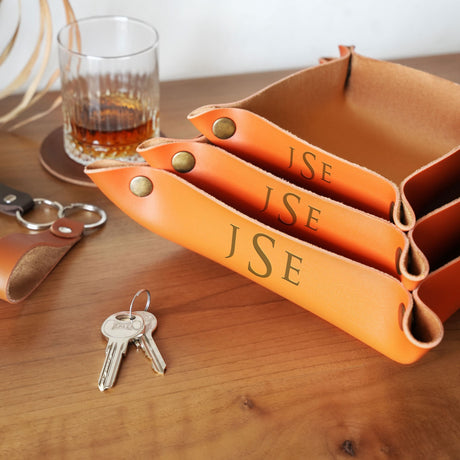 a wooden table topped with a set of keys