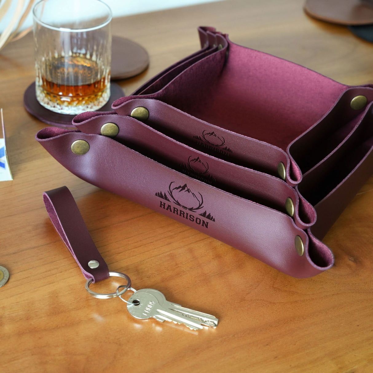 a purple purse sitting on top of a wooden table