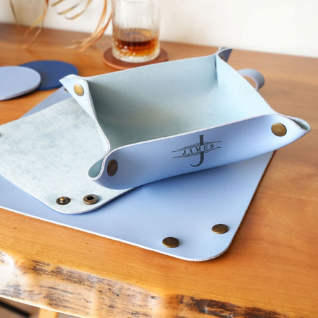 a wooden table topped with a blue tray