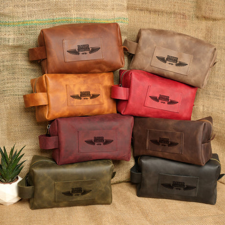 a group of leather bags sitting on top of a couch