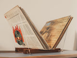 an open book sitting on top of a wooden table