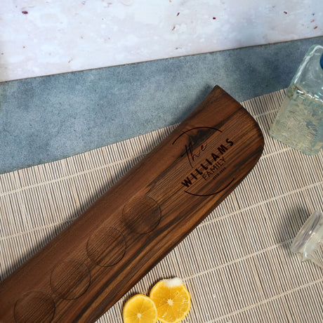 a wooden cutting board sitting on top of a table