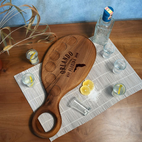 a wooden cutting board sitting on top of a table