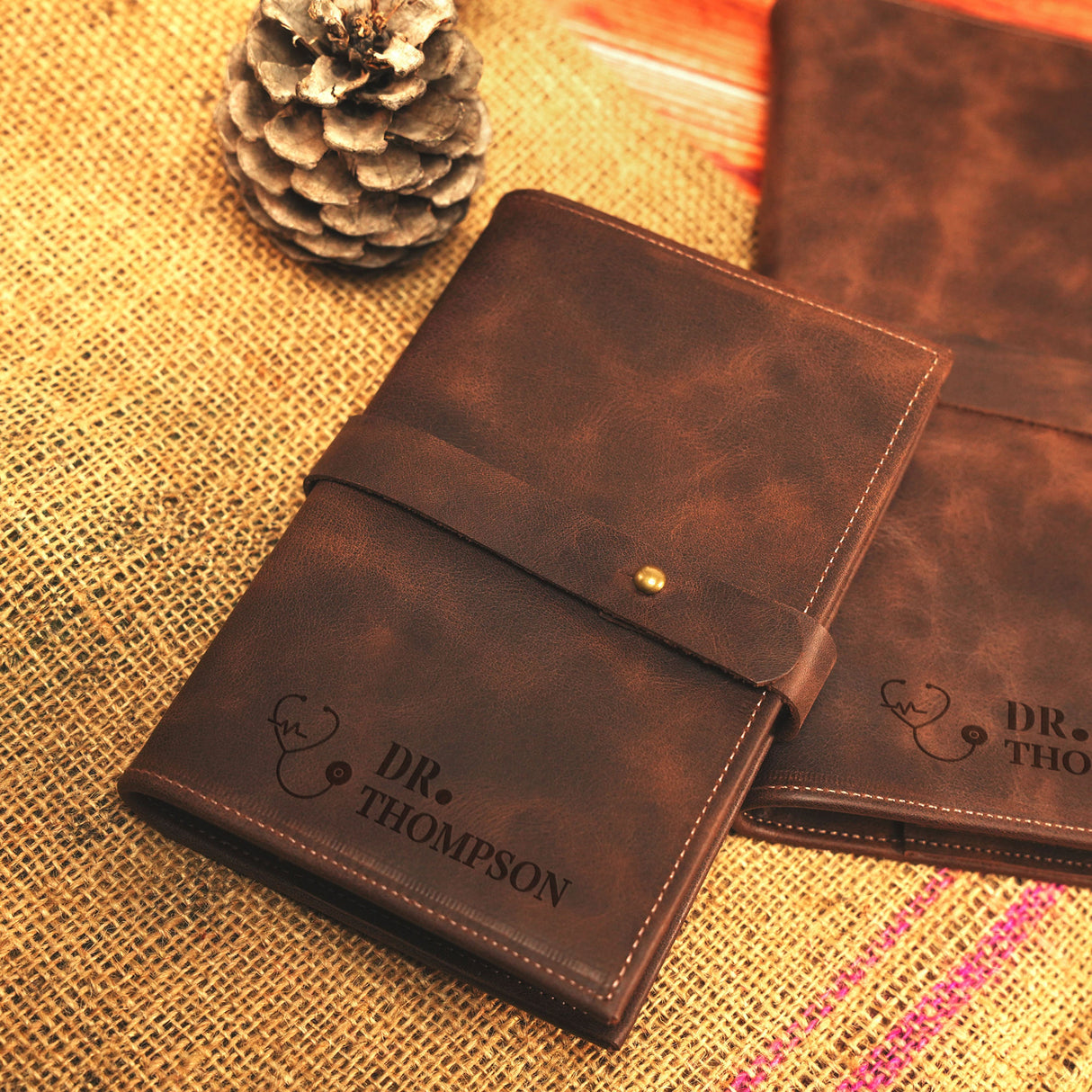 a couple of brown leather cases sitting on top of a table