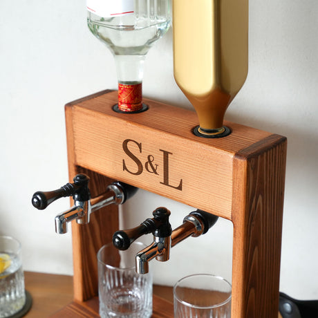 a wooden stand with two glasses and a bottle on it