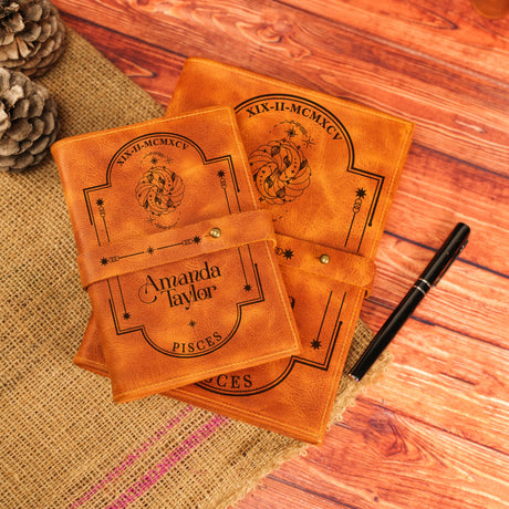 three leather coasters sitting on top of a wooden table